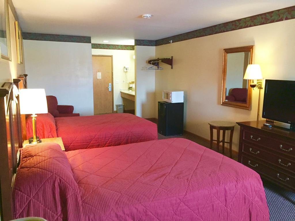 Executive Inn And Suites Вокіган Номер фото